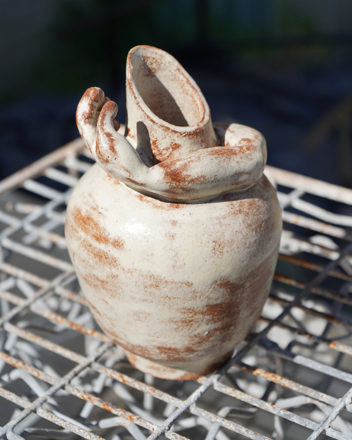 Amphora with hand by Erin Mison